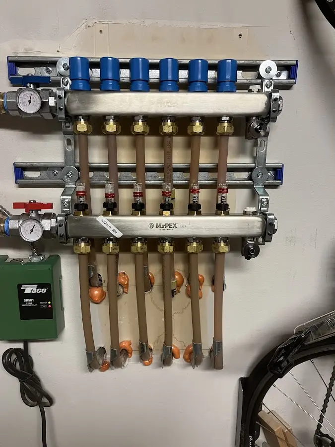 Plumber performing Gas Line Installation at a residential property in Warrensburg